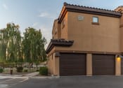 Thumbnail 26 of 51 - a house with a garage and a weeping willow tree in the background