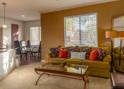 Thumbnail 37 of 51 - a living room filled with furniture and a large window