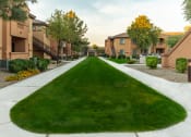 Thumbnail 49 of 51 - a large grassy area with houses on either side