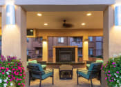 Thumbnail 36 of 51 - a lobby with a fireplace and seating area