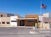 Thumbnail 12 of 56 - The Tucson Landing building has a flag flying in front of it.