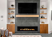 Thumbnail 22 of 56 - A modern living room with a fireplace and a flat screen TV mounted above it.