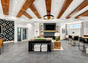 Thumbnail 28 of 56 - A modern kitchen with a central island and a fireplace.