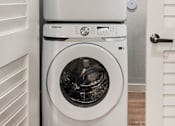 Thumbnail 38 of 56 - Two Samsung front load washing machines in a laundry room.
