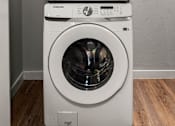 Thumbnail 56 of 56 - A white Samsung washing machine and dryer stacked on top of each other.