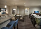 Thumbnail 11 of 29 - a living room and dining room with a table and chairs