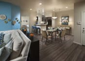 Thumbnail 12 of 29 - a living room and dining room with a table and chairs