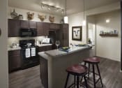 Thumbnail 20 of 29 - a kitchen with a bar and stools