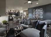 Thumbnail 18 of 29 - a living room with a couch and a table