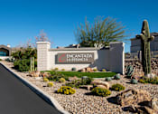 Thumbnail 22 of 22 - A sign that says "FENCANTADA LA ESTANCIA" in front of a cactus.