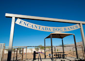 Thumbnail 21 of 22 - A sign that says "Encantada Dog Ranch" is displayed.