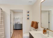 Thumbnail 19 of 53 - a bathroom with a shower and a sink and a toilet
