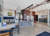 Thumbnail 1 of 53 - the lobby or reception area of a hotel with tables and chairs