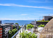 Thumbnail 3 of 38 - a city view from a balcony overlooking the water