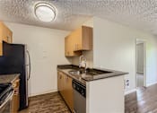 Thumbnail 7 of 33 - a kitchen with a sink and a refrigerator