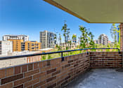 Thumbnail 16 of 33 - the view of the city from the balcony of an apartment building