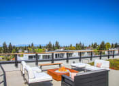 Thumbnail 44 of 53 - the rooftop patio has a fire pit and views of the mountains and trees