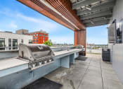 Thumbnail 15 of 27 - the club at highland commons rooftop patio with grill and city views