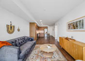 Thumbnail 5 of 53 - a living room with a couch and a coffee table