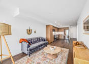 Thumbnail 8 of 53 - a living room with a couch and a coffee table