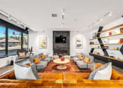 Thumbnail 20 of 53 - a living room with couches and chairs and a fireplace
