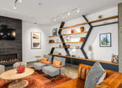 Thumbnail 21 of 53 - a living room with couches and chairs and a fireplace