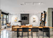 Thumbnail 26 of 53 - a dining room with a table and chairs and a living room