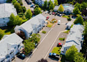 Thumbnail 37 of 38 - A bird's eye view of a residential area with houses and cars.