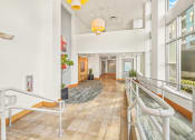 Thumbnail 5 of 42 - the lobby of a building with stairs and large windows