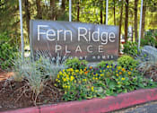 Thumbnail 18 of 28 - A sign that says Fern Ridge Place in front of some trees.