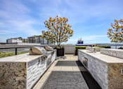 Thumbnail 31 of 38 - the outdoor kitchen has granite counter tops and stainless steel appliances and overlooks the water