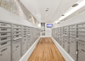 Thumbnail 25 of 27 - a long room with many filing cabinets and a television in the back