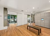 Thumbnail 23 of 27 - a large living room with a wood floor and a wooden bench