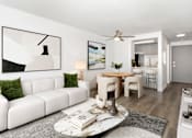 Thumbnail 1 of 13 - a living room with a couch and a table