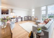 Thumbnail 2 of 27 - an open living room and kitchen with a view of the eiffel tower