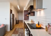 Thumbnail 3 of 27 - a kitchen with a stove top oven next to a refrigerator