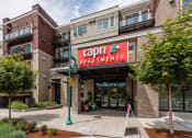 Thumbnail 13 of 48 - a building with a red sign that reads capital apartments