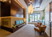 Thumbnail 18 of 48 - a lobby with a couch and chairs