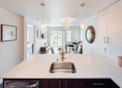 Thumbnail 2 of 48 - a view of the kitchen and living room from behind the counter