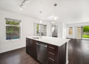 Thumbnail 29 of 48 - a kitchen with a large island and a large window