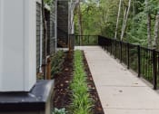 Thumbnail 23 of 24 - the walkway up to the house is lined with plants and trees