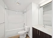 Thumbnail 48 of 48 - a bathroom with a shower toilet and sink