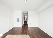 Thumbnail 45 of 48 - a renovated living room with white walls and wood floors