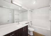 Thumbnail 47 of 48 - a bathroom with a sink toilet and a shower