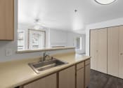 Thumbnail 6 of 29 - the kitchen of a home with a sink and cabinets