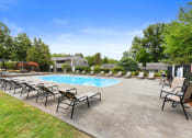 Thumbnail 14 of 22 - our apartments have a resort style pool with chaise lounge chairs