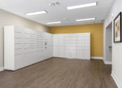 Thumbnail 27 of 35 - an empty room with white lockers and a yellow wall