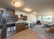 Thumbnail 13 of 20 - a kitchen and living room in a 555 waverly unit