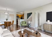 Thumbnail 1 of 33 - a living room and dining room with a table and chairs
