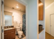 Thumbnail 11 of 20 - a bathroom with a toilet sink and shower